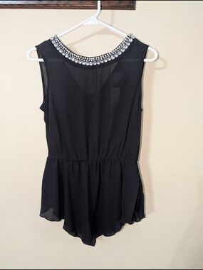 Fashion Magazine Black Sleeveless Chiffon Peplum Top with Jeweled Neckline